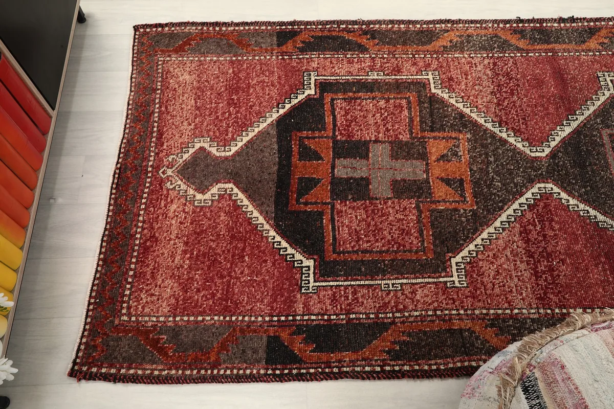 Overhead shot of one end of the runner rug, showing the full width and pattern details