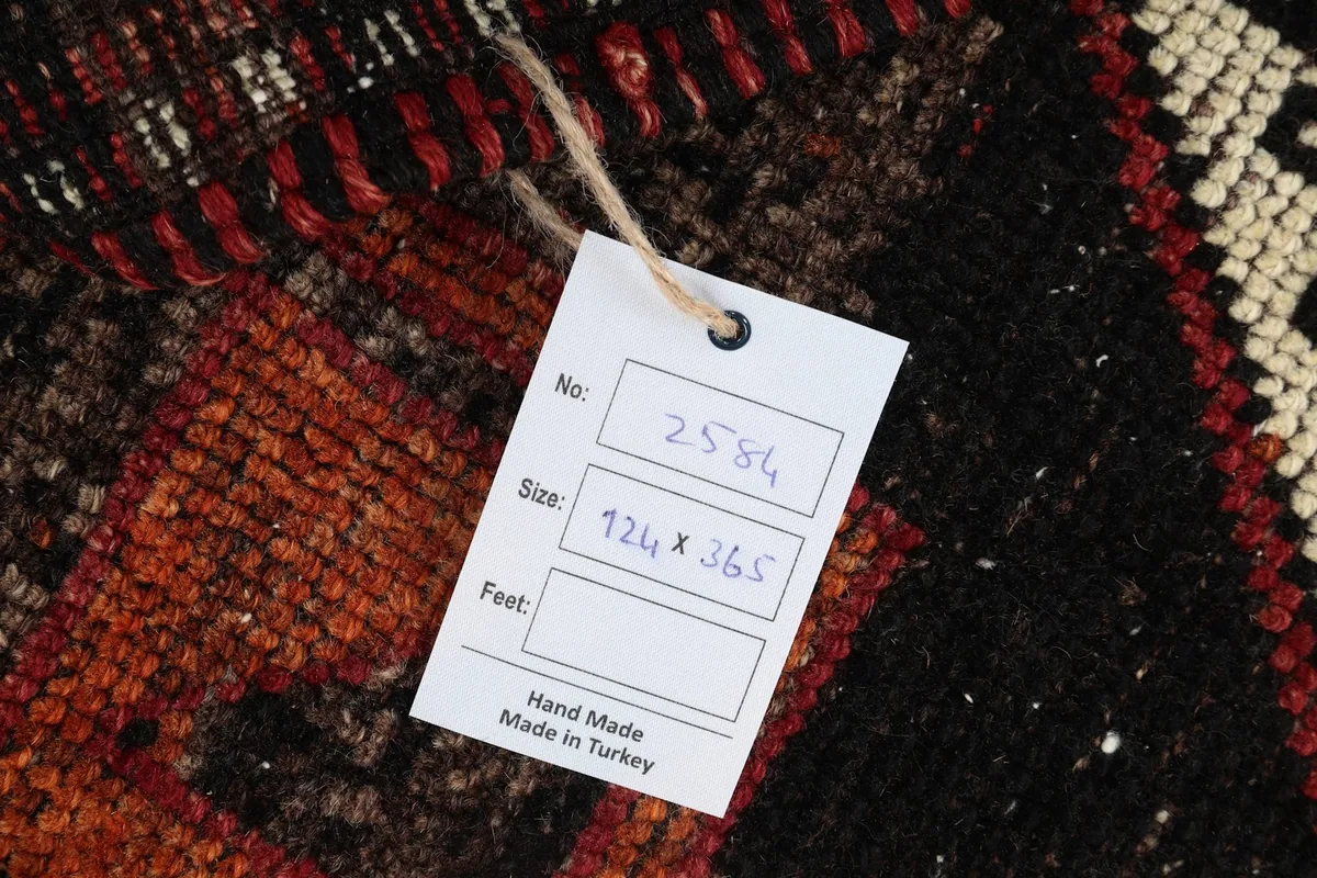 Tag showing the rug's unique number and dimensions, confirming its hand-made origin in Turkey