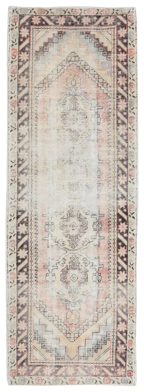 Full overhead view of the beige and rose geometric Anatolian runner rug