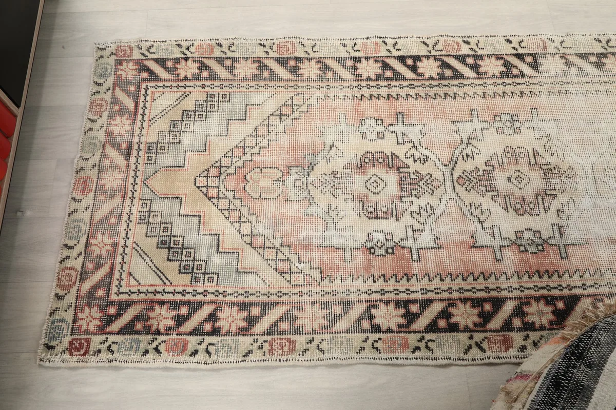 Angled top view of the runner rug, capturing its full design and color blend