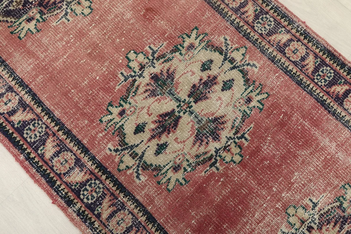 Close-up overhead view of a central geometric medallion and the surrounding rose field.
