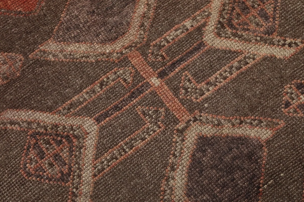 Macro detail of the hand-knotted wool pile showing texture and color variations