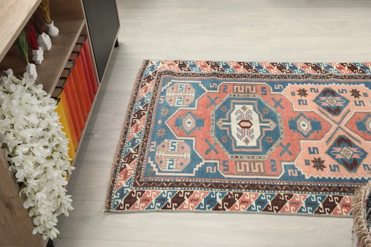 Overhead view of the rug, illustrating its full pattern and colors in a room setting