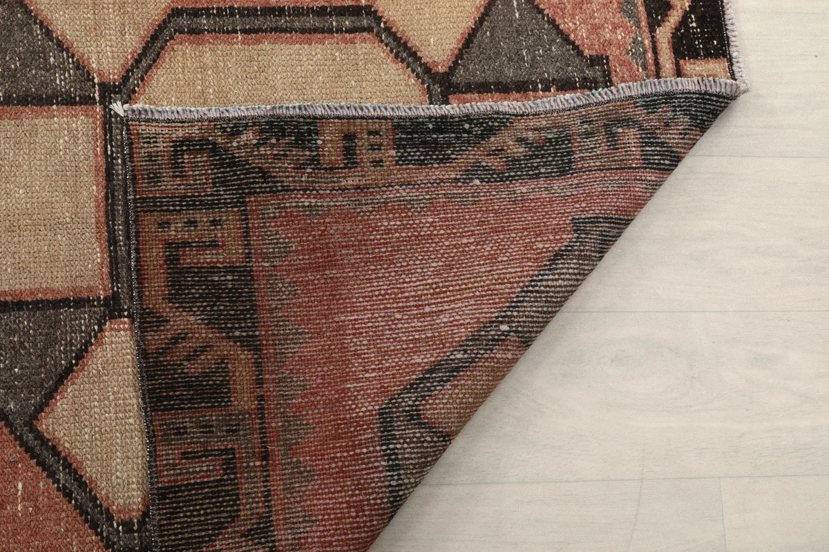 Underside view of the runner, showing the hand-knotted construction