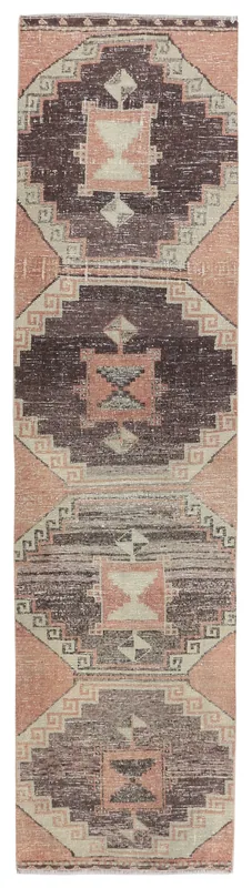 Full top view of the vintage Anatolian runner rug with rose, brown, beige, and gray geometric patterns.