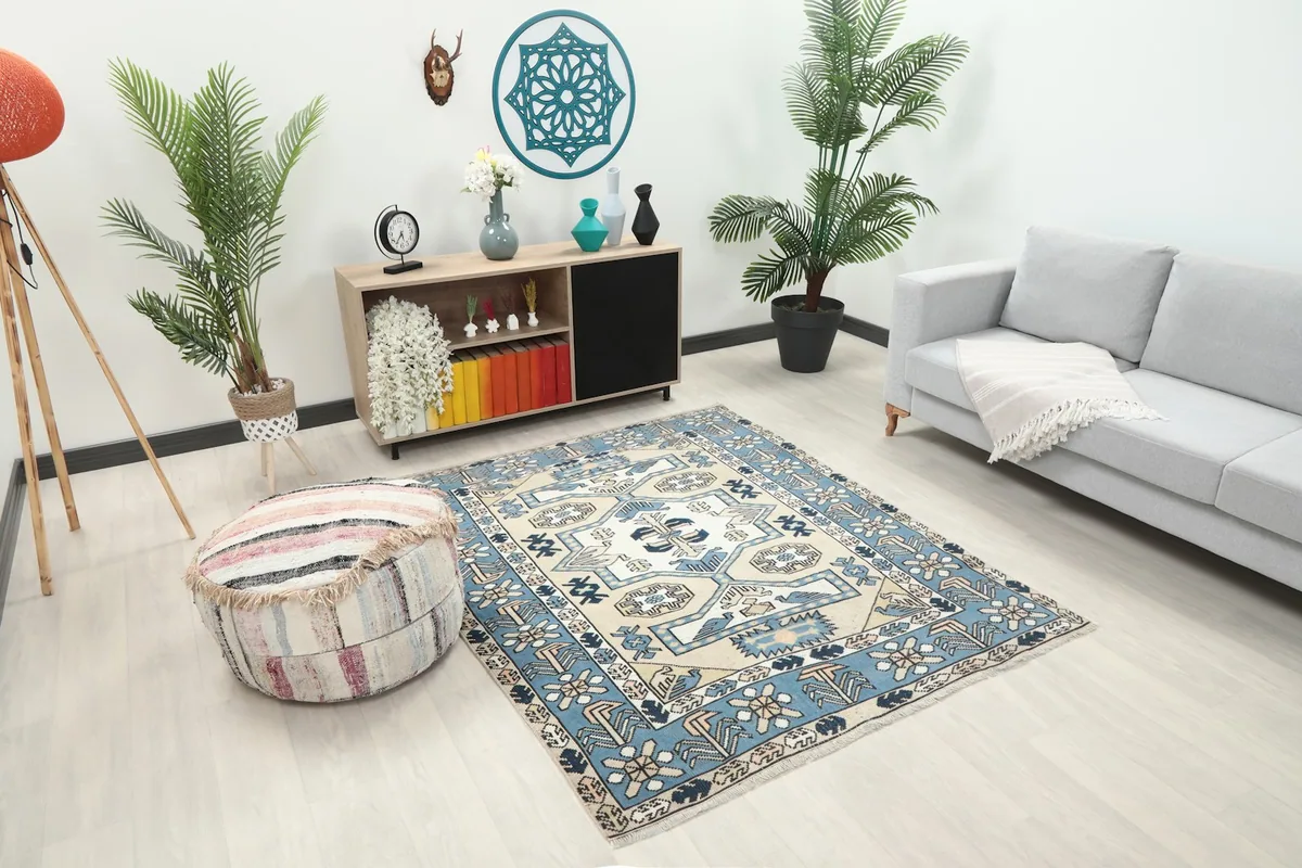 Angle view of the blue and beige geometric rug in a modern living room