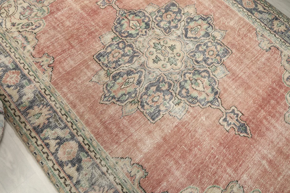 Overhead angle highlighting the central medallion and surrounding rose field