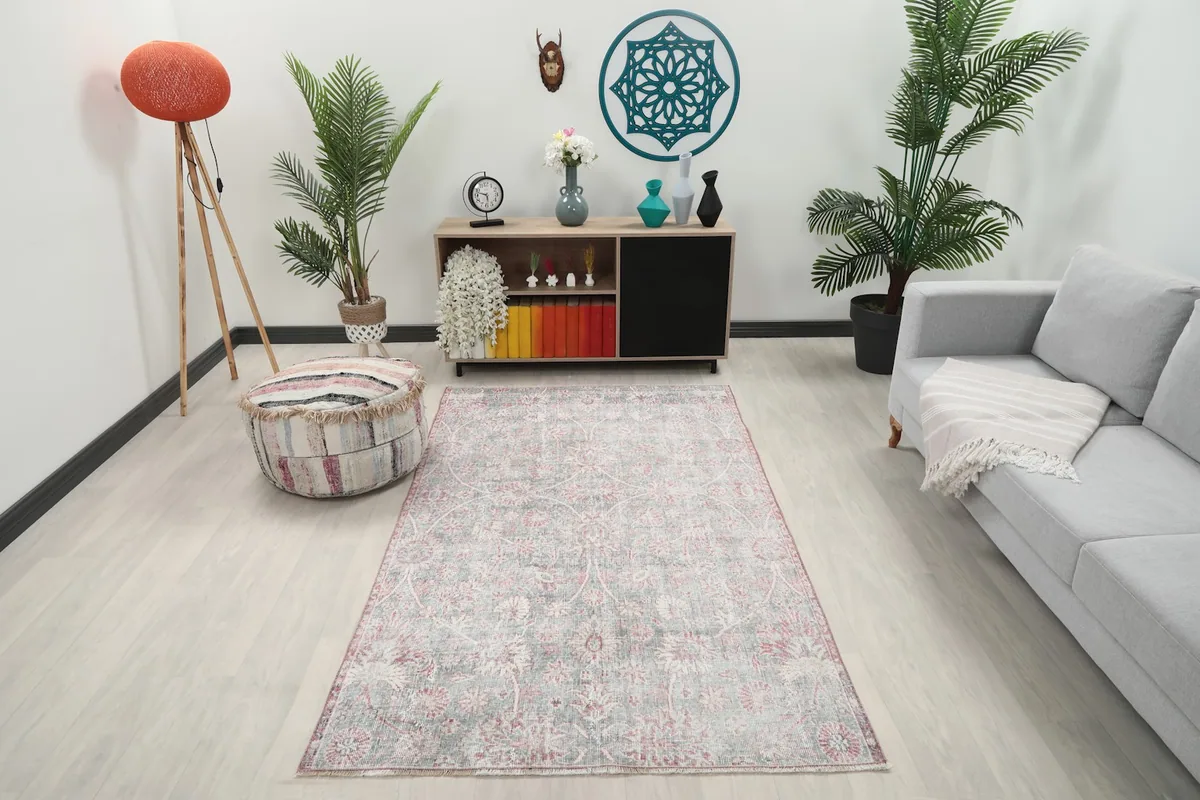Area rug in a room setting, showing its scale next to a sofa and cabinet