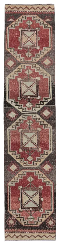 Full top view of the 2'7" x 12'4" vintage Anatolian runner rug with geometric patterns in rust, brown, and beige