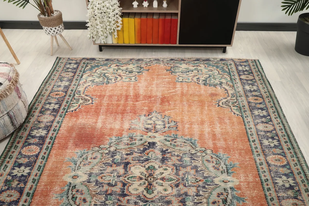 View of the vintage rug in a room setting, focusing on the rug's full length