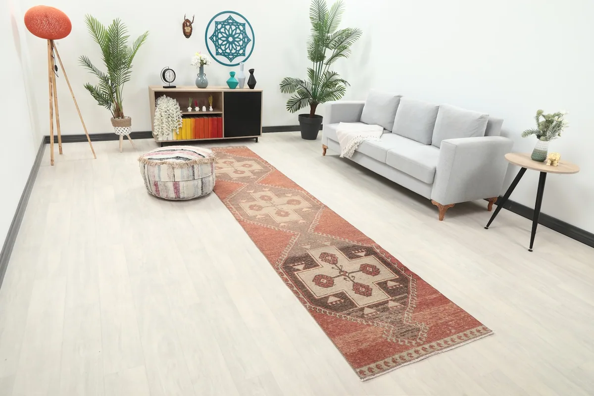 Angled view of the rust and brown runner extending through a contemporary living space