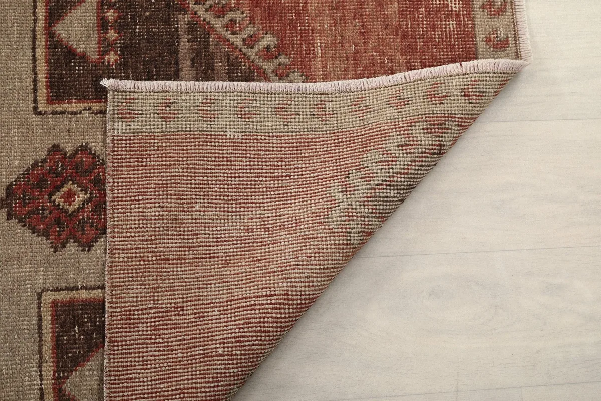 Another view of the rug's reverse, showcasing the tight hand-knotting and foundation