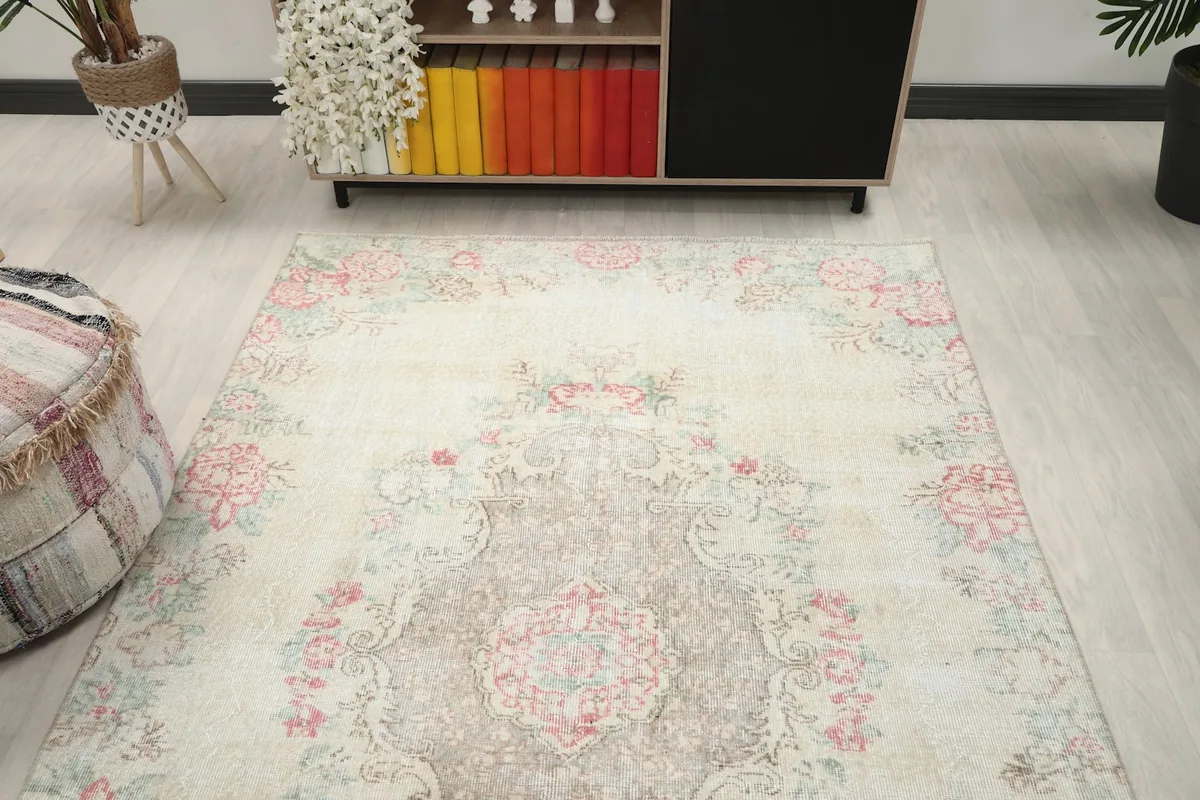 Overhead angled view of the rug in a room, capturing its full design and colors