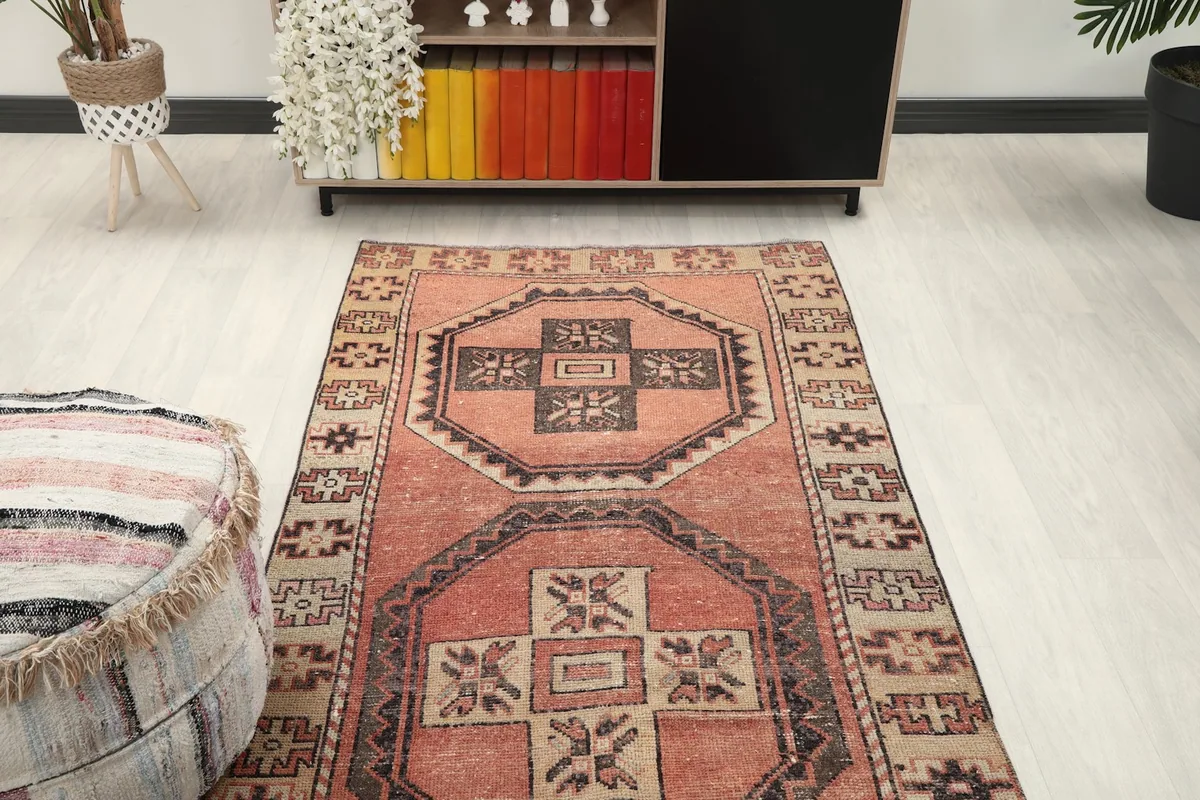 Overhead view of the vintage runner rug in a room, showing its length and pattern flow