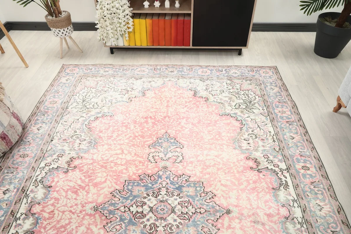 Vintage rug from a wider room perspective, highlighting its size and placement in the space