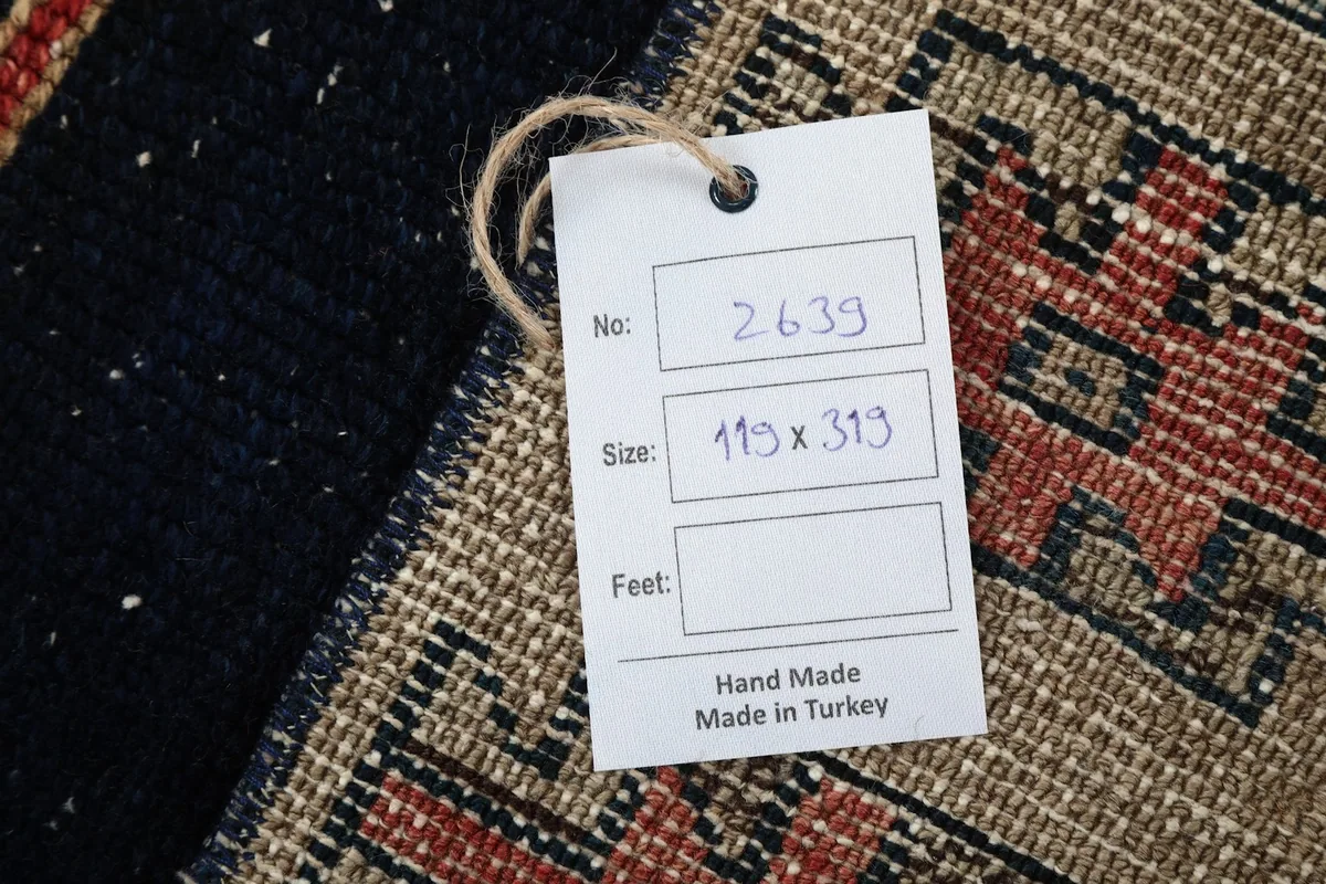 Product tag displaying the rug's dimensions and origin: Hand Made in Turkey