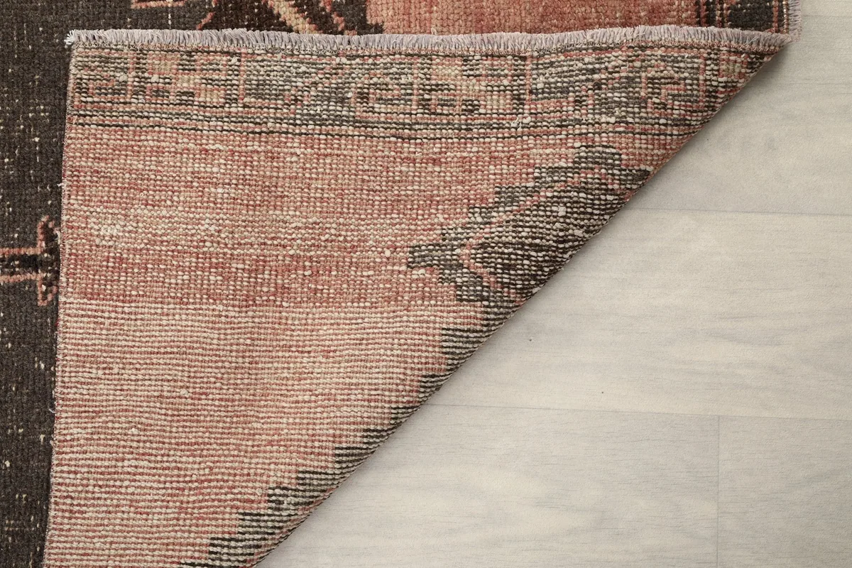Another view of the rug's reverse side, illustrating the hand-knotted construction