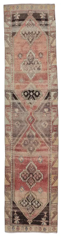 Full overhead view of the 3'6" x 14'3" vintage Anatolian runner with rose, brown, and beige geometric patterns