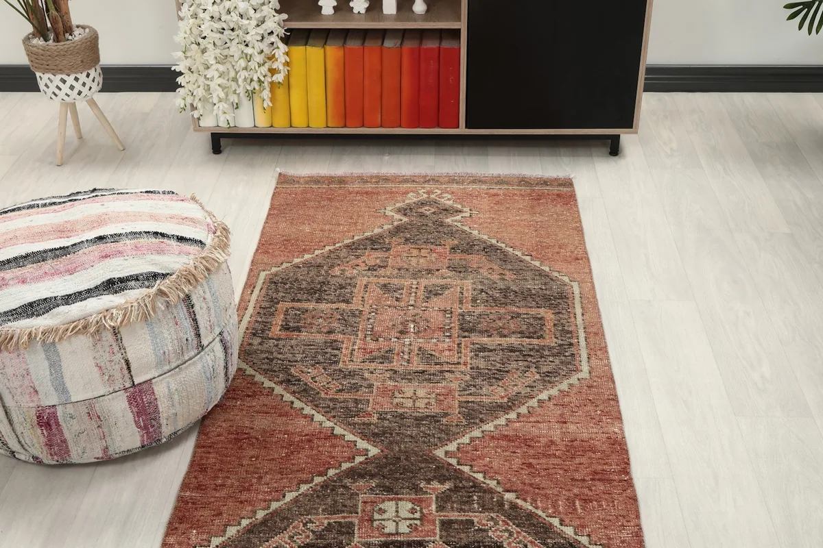 Overhead view of a section of the runner rug in a room, highlighting the geometric design
