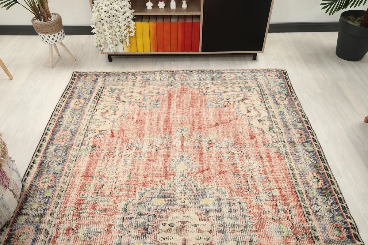 Overhead view of the vintage rug in a room setting, highlighting its full design and proportions