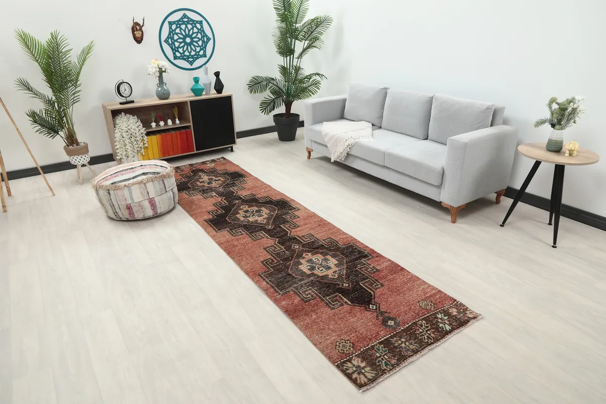 Angled view of the vintage runner rug showcasing its length in a contemporary room setting
