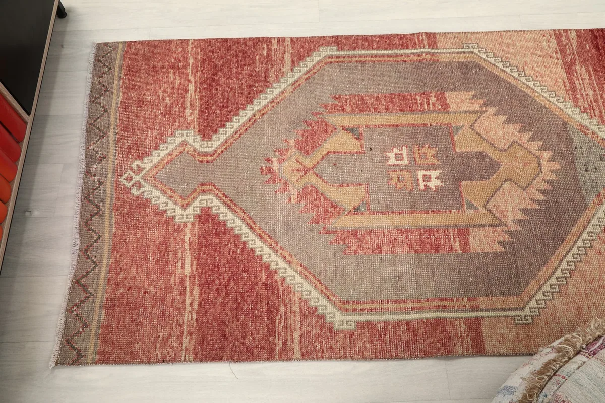 Overhead view of a section of the runner rug, showing the geometric medallion design