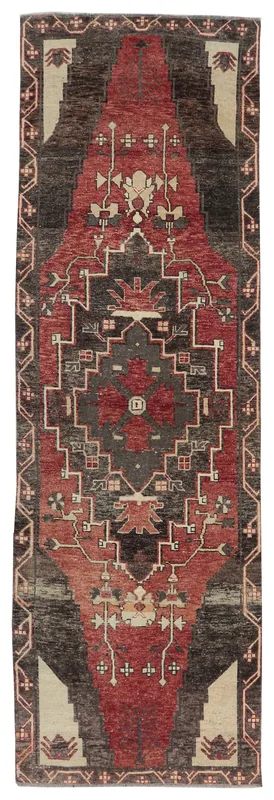 Full overhead view of the vintage Anatolian runner rug with red and charcoal geometric patterns