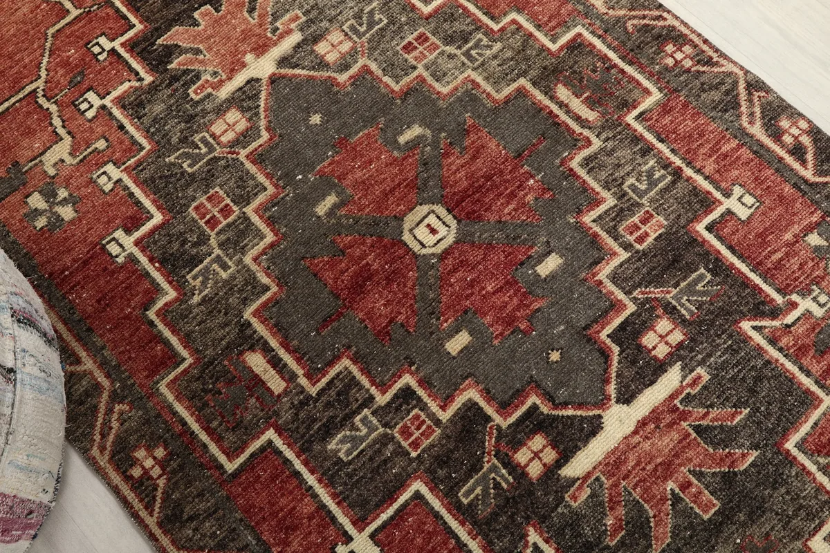 Close-up showing the central geometric medallion and surrounding tribal motifs
