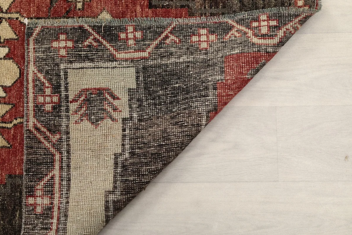 Another perspective of the rug's reverse side, illustrating its construction