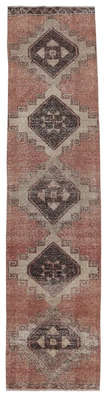 Full overhead view of the rust and beige geometric vintage Anatolian runner rug on a white background.