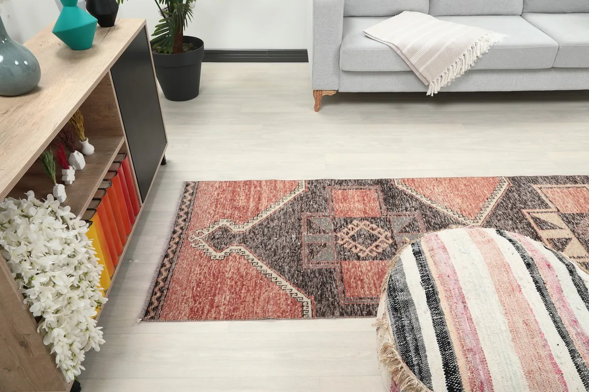 Angled room view of the runner rug, showcasing its length and how it complements the furniture