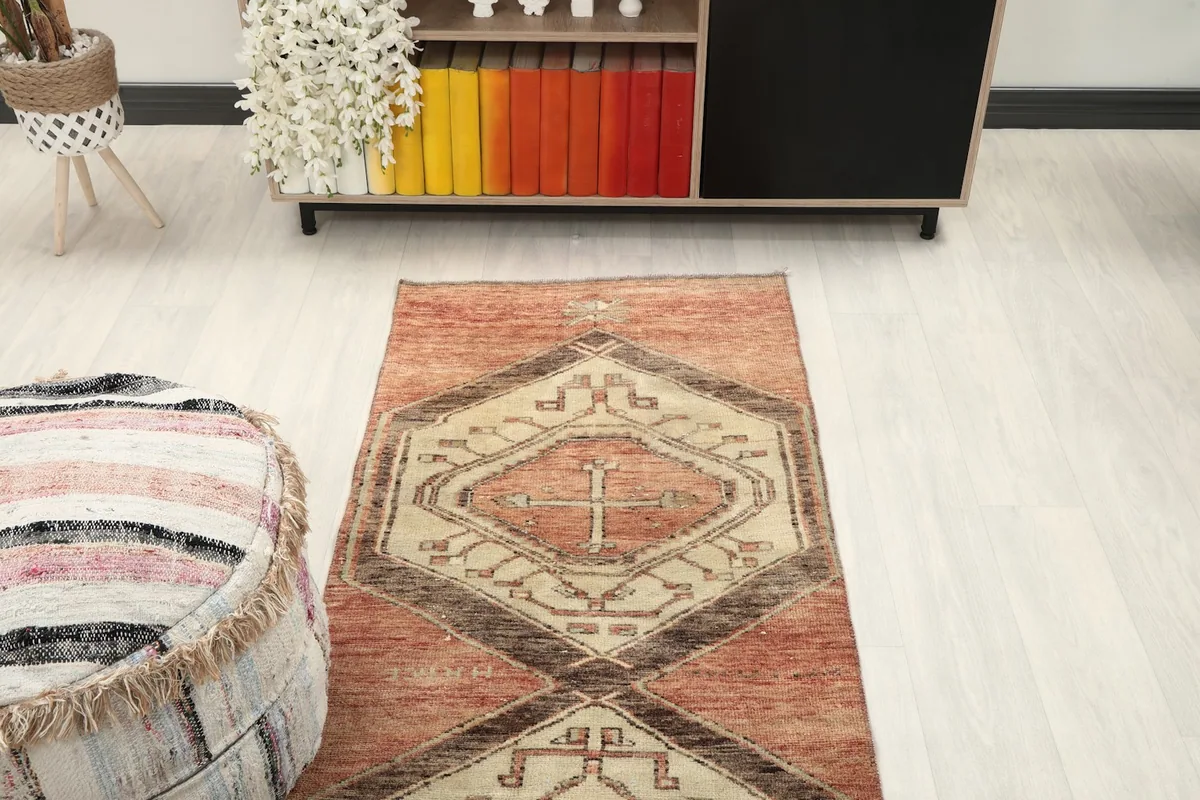 Angled view looking down the length of the runner rug, highlighting its geometric design.