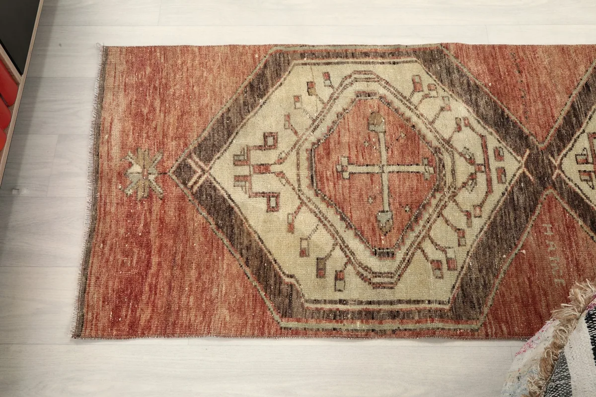 Overhead view of one end of the runner rug, showing the geometric patterns.