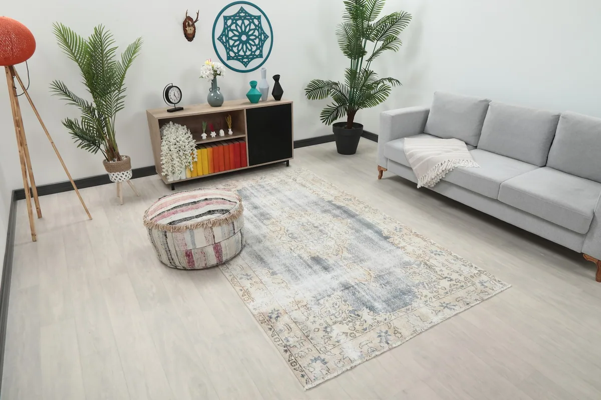 Angled view of the Faded Gray Floral Medallion rug in a contemporary living space