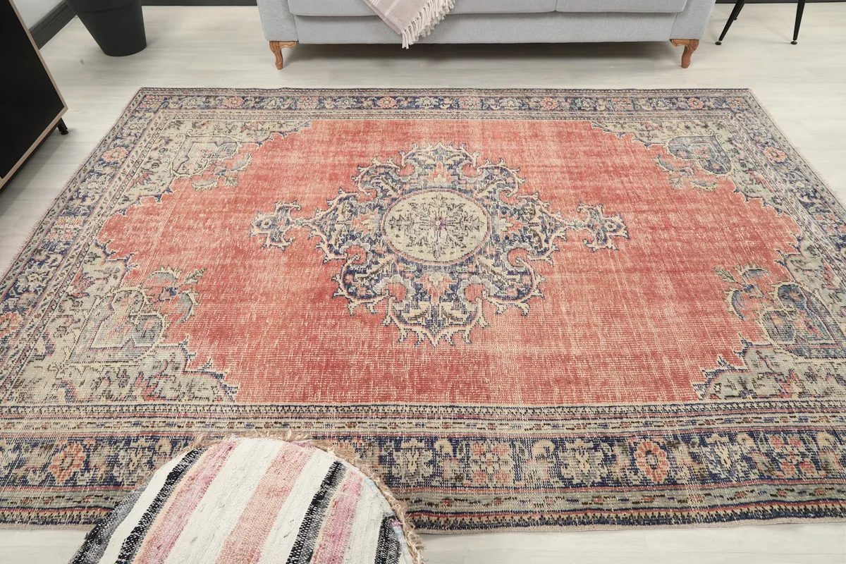 Frontal view of the rug in a room setting, emphasizing the full design and colors