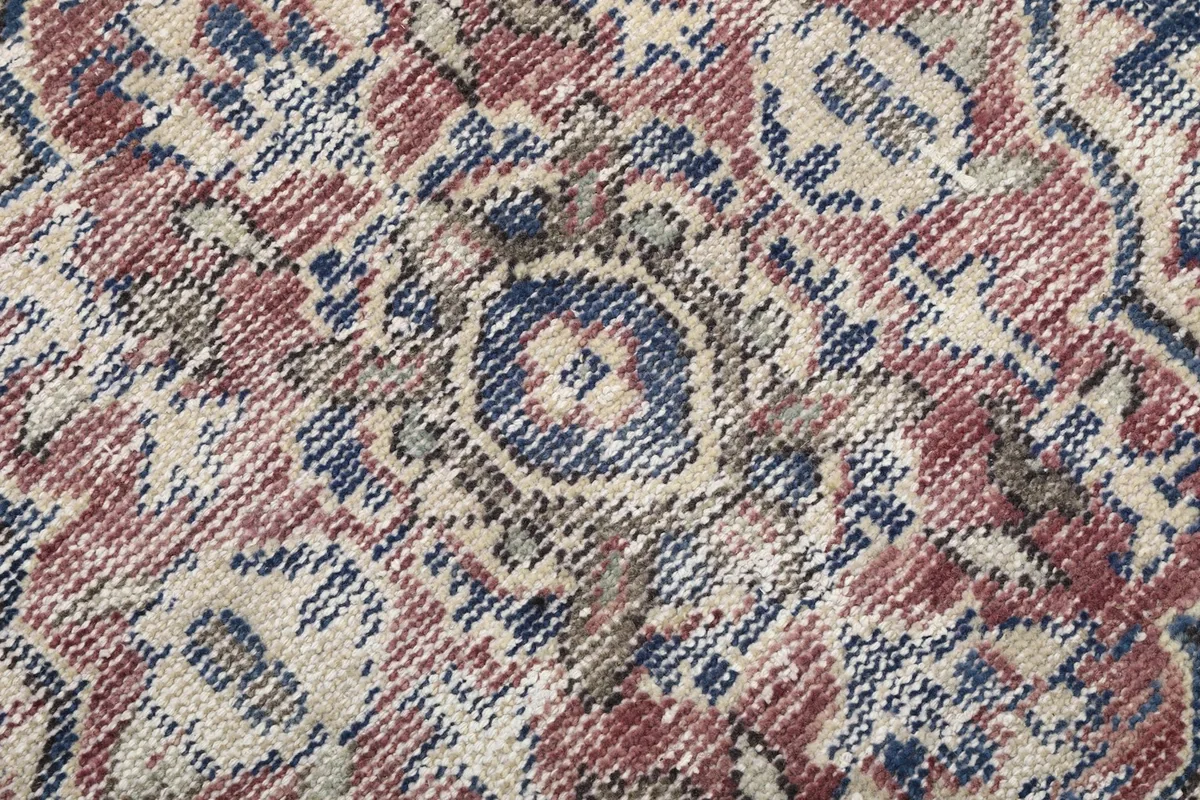 Extreme close-up of the low wool pile showing color variations and texture