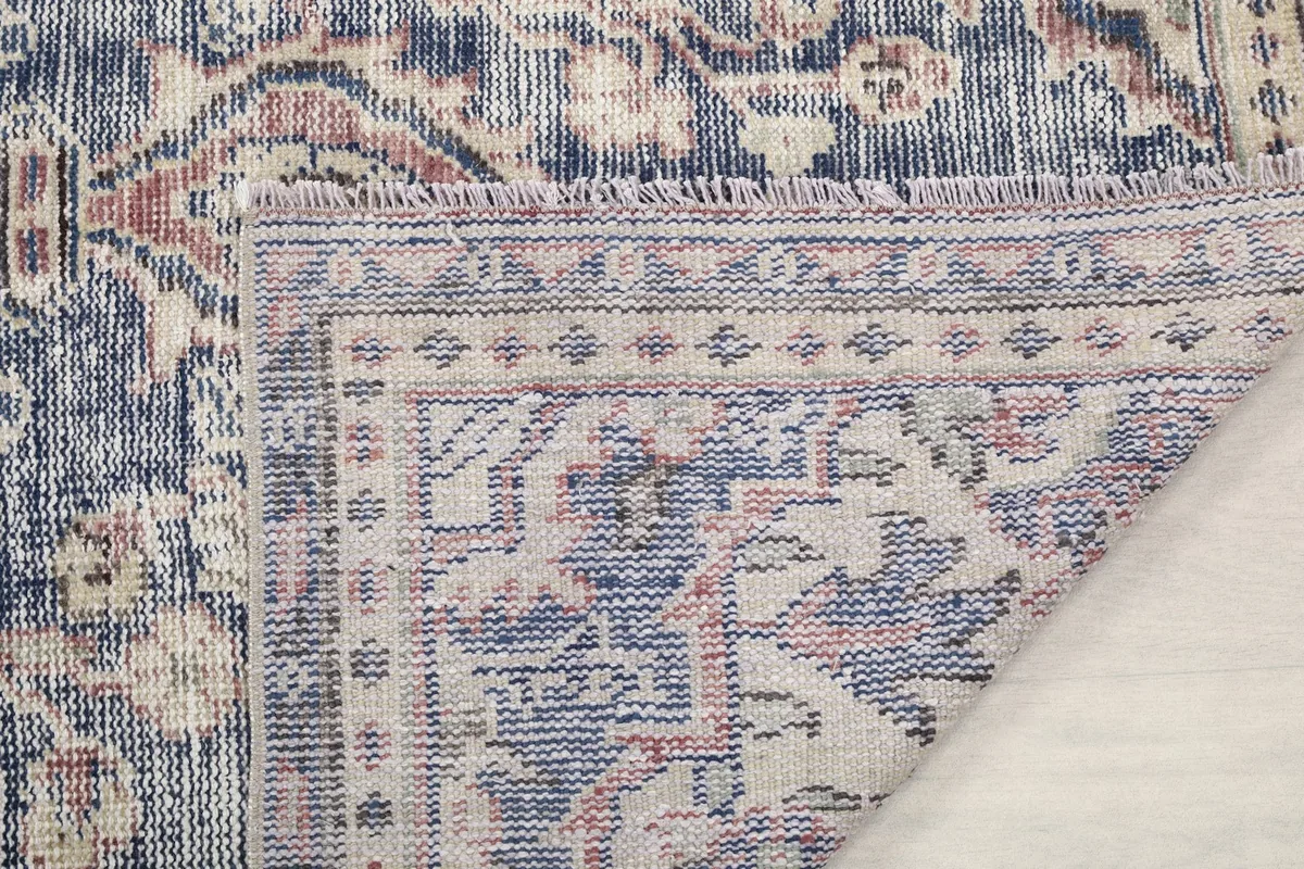 Detail of the rug's fringe and the back of the border, showing construction