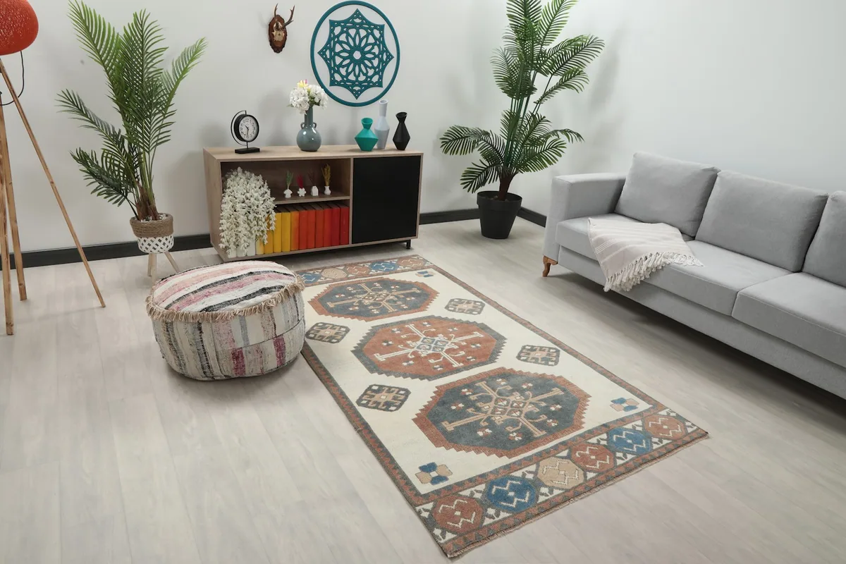 Angled view of the rug in a living room, highlighting its placement next to a sofa