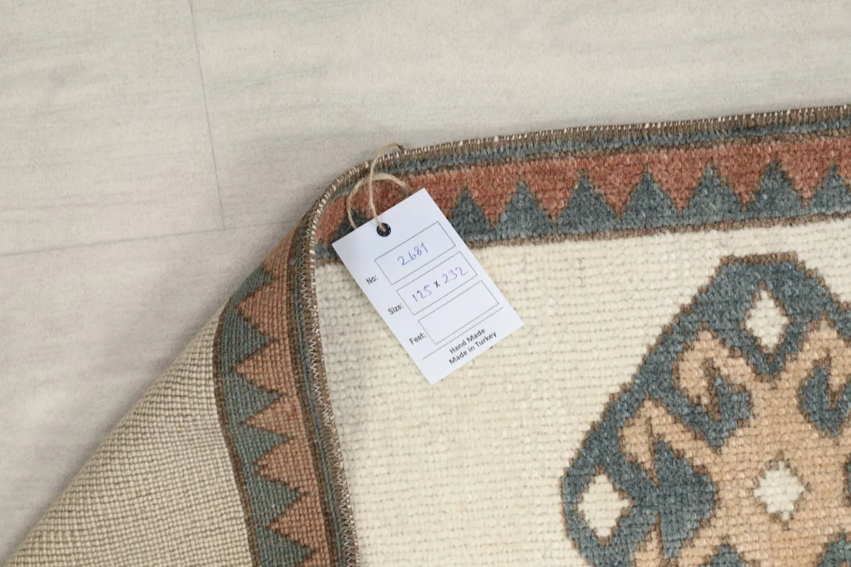 Corner of the rug with a product tag showing size and material information