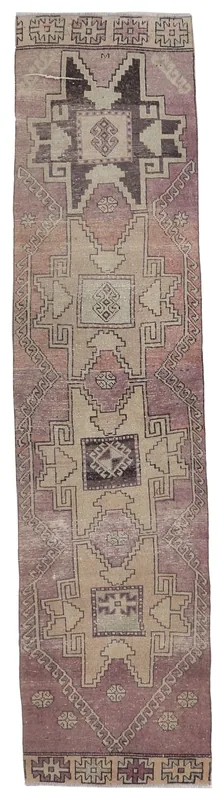 Full overhead view of the 2'5" x 10'5" vintage Anatolian runner on a white background, showcasing its rose, beige, and