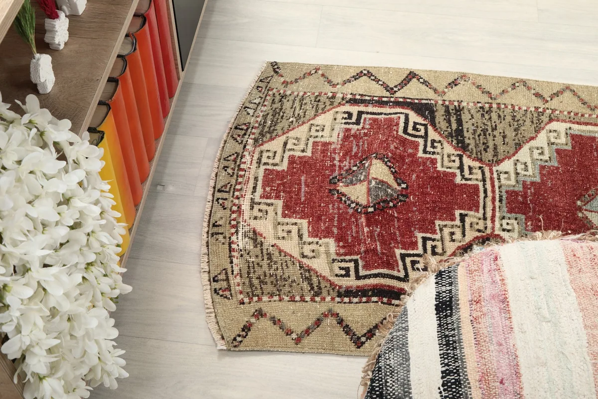 Upper section of the rug from an angle, showcasing the patterns and colors