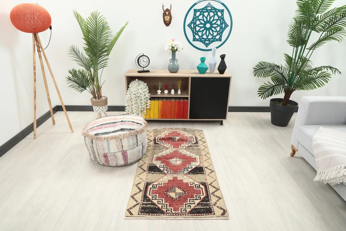 Vintage Anatolian rug displayed in a room setting with modern furniture