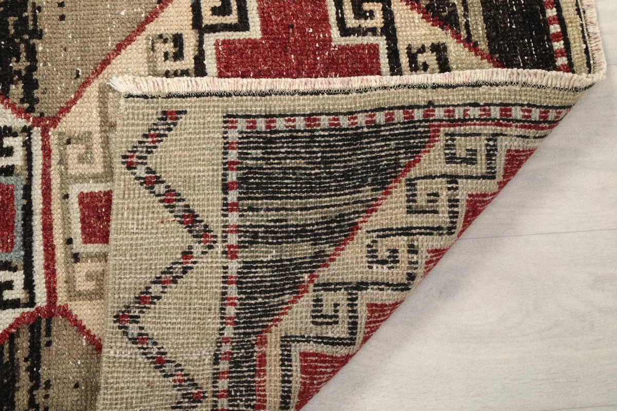 Another folded corner view, showing the construction of the vintage wool rug