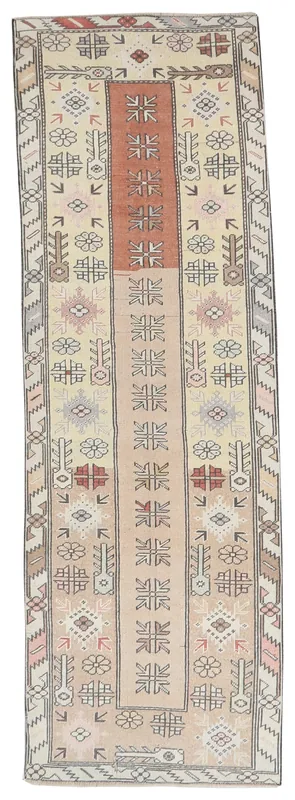 Full overhead view of the hand-knotted vintage Anatolian runner rug with rust and cream colors