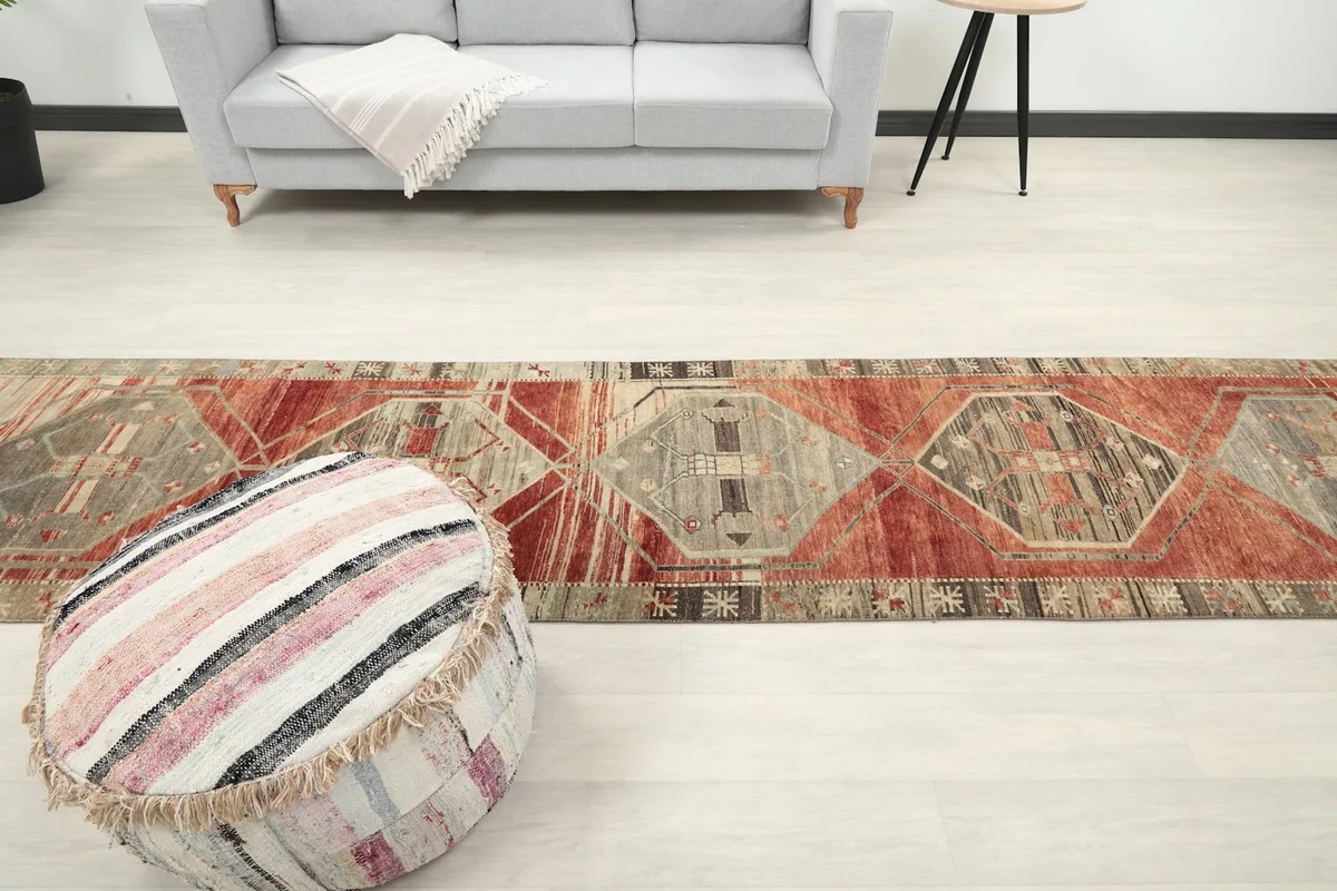 Overhead perspective of the runner rug in a room, emphasizing its long, narrow shape