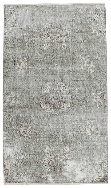 Full top view of the vintage gray floral Anatolian area rug on a white background.