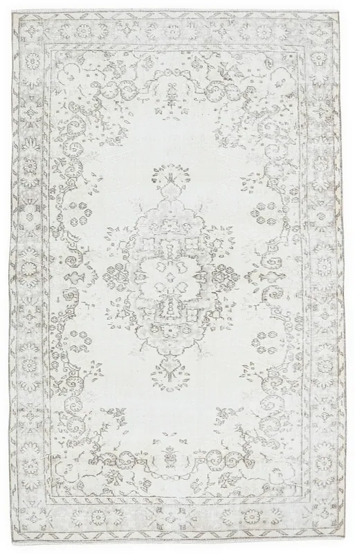 Full top view of the 5'1" x 8'9" vintage Anatolian rug on a white background, displaying its cream and gray tones.