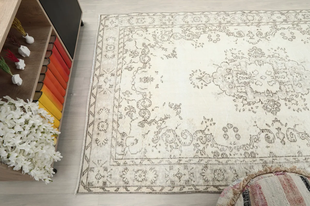 Top-down angle showcasing the rug's full length and width within the room setting, emphasizing its medium size.