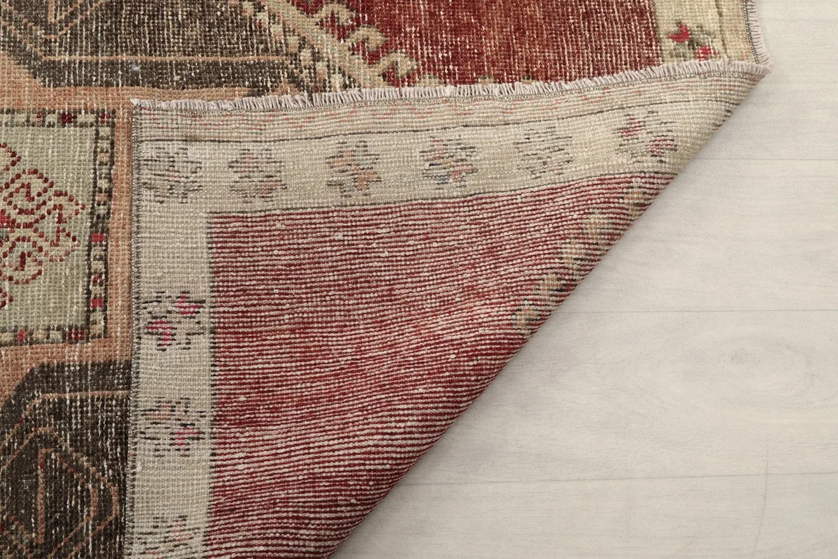 Another view of the back of the runner, revealing the intricate knotting and foundation.