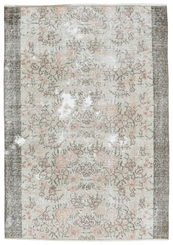 Full top view of the 3'10" x 5'5" beige and rose vintage Anatolian area rug